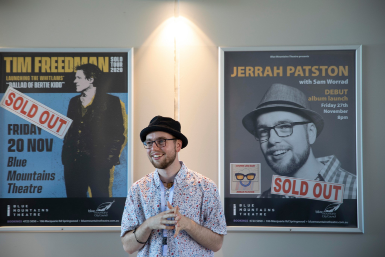 Jerrah in front of sold out concert sign